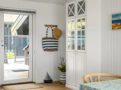 a door leading into a room with a porch at Holiday Home Jannus - 600m from the sea by Interhome in Saltum