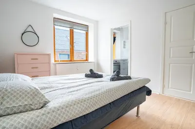 a bedroom with a bed with two teddy bears on it at Modernized Bed & Bath in Holstebro