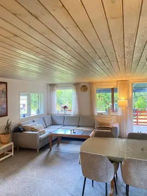 a living room with a couch and a table at Ålevænget 1 in Gedsted