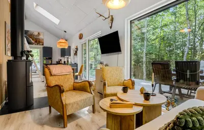a living room with chairs and a table at Amazing Home In Aars With Wifi in Års