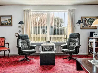 a living room with two chairs and a window at 4 person holiday home in Bøvlingbjerg in Bøvlingbjerg