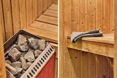 a tub filled with rocks next to a wooden wall at 288-Harboore-Doblervej-15 in Harboør