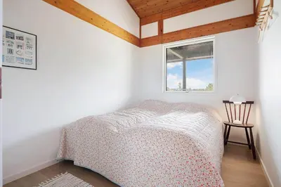 a bedroom with a bed and a window at LK2113-Lokken-Kettrup-Bjerge-vej-67 in Løkken