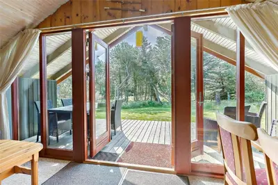 a room with sliding glass doors in a house at LK473-Lokken-Kettrup-Bjerge-Vej-47 in Løkken
