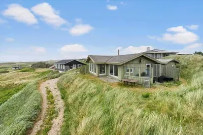 a house sitting on top of a grass covered field at LK1456-Lokken-Magdavej-9 in Løkken