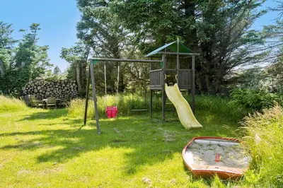 a playground with a slide and a slideintend at LK1924-Lokken-Lydiavej-4 in Løkken