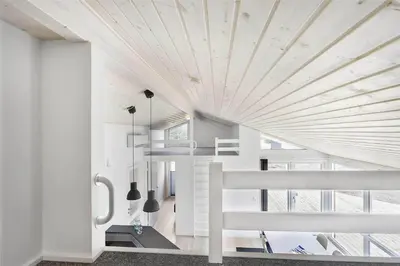 a white house with a wooden ceiling at LK1423-Lokken-Rikkesvej-4 in Løkken