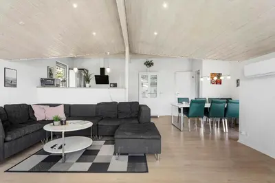 a living room with a couch and a table at LK1892-Lokken-Marthinesvej-37 in Løkken