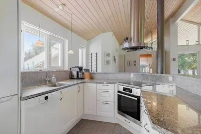 a kitchen with a sink and a stove top oven at LK781-Lokken-Margrethevej-6 in Løkken