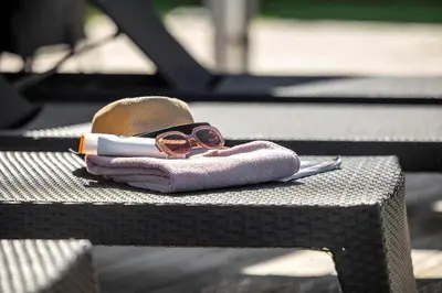 a pair of sunglasses sitting on top of a bench at LK781-Lokken-Margrethevej-6 in Løkken