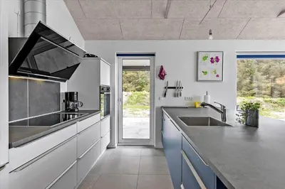 a kitchen with a sink and a counter top at LK1824-Lokken-Marthasvej-16 in Løkken