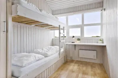 a room with two bunk beds and a window at LK552-Lokken-Ornegaardsvej-14 in Løkken