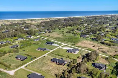 an aerial view of a park with houses and the ocean at LK2095-Lokken-Mievej-28 in Løkken