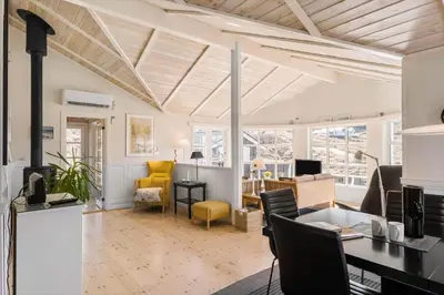 a living room with a table and a dining room at LK322-Lokken-Ornegaardsvej-27 in Løkken