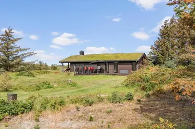 a house with a grass roof on a hill at LK2007-Lokken-Stellavej-11 in Løkken