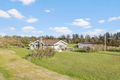 a house in a field with a yard at LK561-Lokken-Lisbethsvej-1 in Løkken