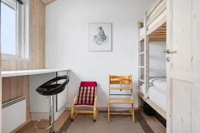 a room with two chairs and a bunk bed at LK310-Lokken-Magdalenevej-39 in Løkken