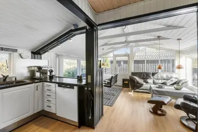 an open kitchen and living room in a house at LK564-Lokken-Piasvej-17 in Løkken