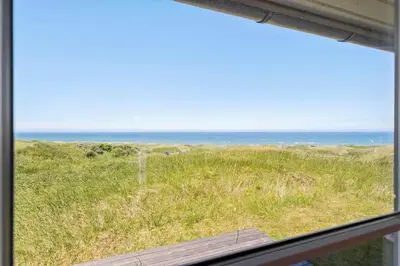 a view of the ocean from a window at LK528-Lokken-Rosavej-5 in Løkken