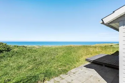 a view of the ocean from the porch of a house at LK528-Lokken-Rosavej-5 in Løkken