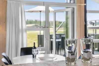 a table with a sink and two glasses on it at LK248-Lokken-Sinnesvej-43 in Løkken