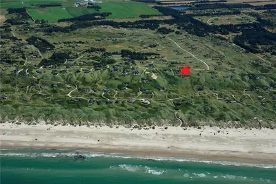 an aerial view of a beach with a red ball at LK1609-Lokken-Kettrup-Bjerge-Vej-82 in Løkken