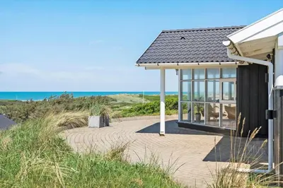 a building with a walkway next to the beach at LK329-Lokken-Marensvej-12 in Løkken