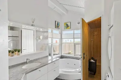 a white bathroom with a sink and a toilet at LK329-Lokken-Marensvej-12 in Løkken