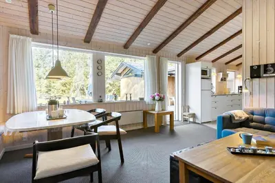 a living room with a couch and a table at LK741-Lokken-Madsinesvej-1 in Løkken