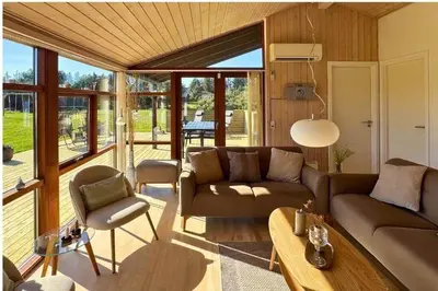 a living room with a couch and a table at LK537-Lokken-Mievej-20 in Løkken