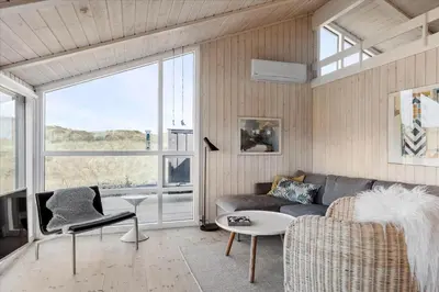 a living room with a couch and a table at LK1847-Lokken-Ornegaardsvej-17 in Løkken