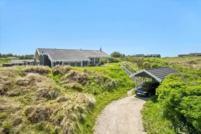 a house with a car parked in front of it at LK431-Lokken-Kettrup-Bjerge-Vej-62 in Løkken