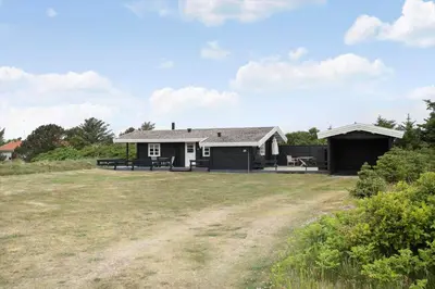 a house with two sheds and a yard at LK1955-Lokken-Laurasvej-10 in Løkken