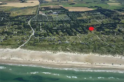 an aerial view of a beach with a red dot at LK1354-Lokken-Madsinesvej-4 in Løkken
