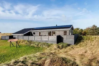 a house with a solar roof on a hill at LK2112-Lokken-Kettrup-Bjerge-Vej-64 in Løkken
