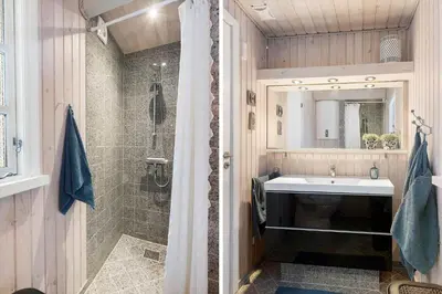 a bathroom with a sink and a shower at LK2029-Lokken-Magdalenevej-55 in Løkken