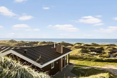 a house on the beach with the ocean in the background at LK1958-Lokken-Kettrup-Bjerge-Vej-78-A in Løkken
