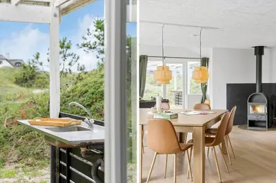 a kitchen and dining room with a table and chairs at BL1440-Blokhus-Moreavej-2 in Blokhus