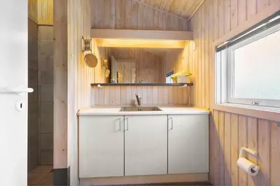 a small kitchen with a sink and a window at LK850-Lokken-Jorginesvej-8 in Løkken