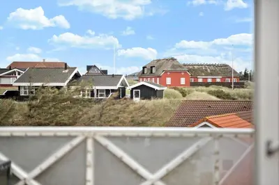 a view from a balcony of houses and roofs at BL1583-Blokhus-Strandvejen-14-Lejl-12 in Blokhus