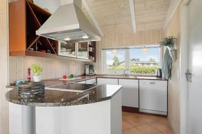 a kitchen with a sink and a counter top at BL1201-Blokhus-Stromsvej-1 in Blokhus