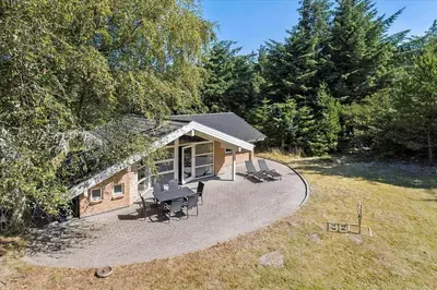 an overhead view of a small house with a patio at BL1736-Blokhus-Slettevej-3 in Blokhus