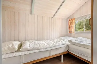 a room with two beds and a window at LK599-Lokken-Stellavej-16 in Løkken