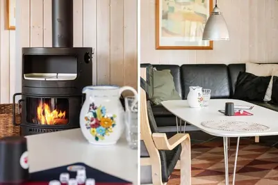 a living room with a couch and a fireplace at LK599-Lokken-Stellavej-16 in Løkken
