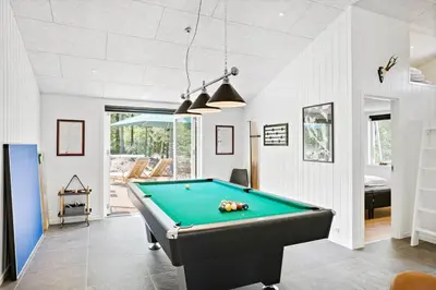 a billiard room with a pool table in it at BL1535-Blokhus-Saetergaardsstien-5-A in Blokhus