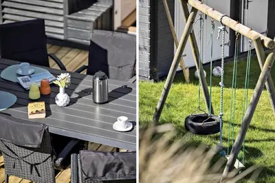 a picnic table in a yard with a chair and a tableablish at BL124-Blokhus-Klitvejen-75-a in Blokhus