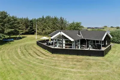 a large house in the middle of a field at LK1813-Lokken-Jorginesvej-3 in Løkken