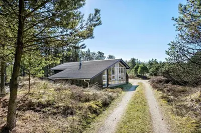a small house in the middle of a dirt road at BL1789-Saltum-Krogsletten-20 in Saltum