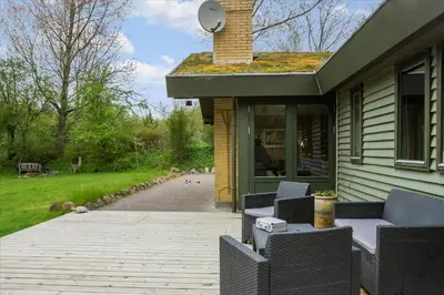 a patio with chairs and a table on a house at BL128-Saltum-Klaus-Bjergsvej-9 in Saltum