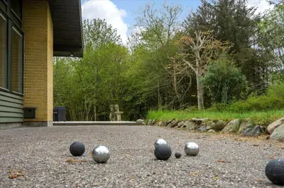 a group of balls on the ground in front of a building at BL128-Saltum-Klaus-Bjergsvej-9 in Saltum